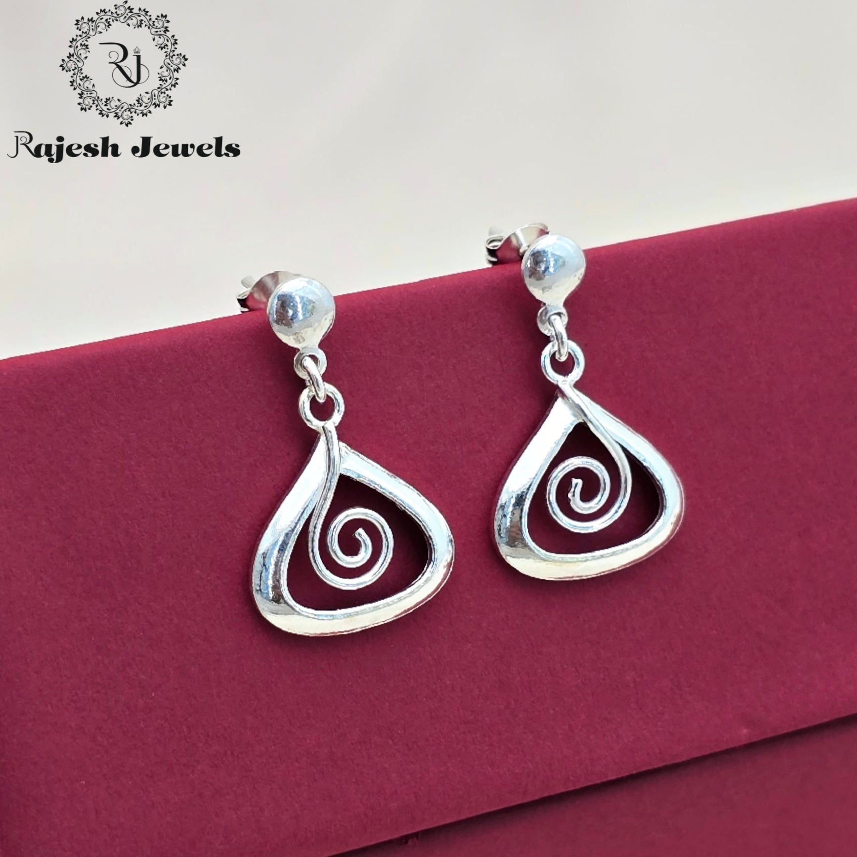 Swirling Plain White Finish Hanging Earrings