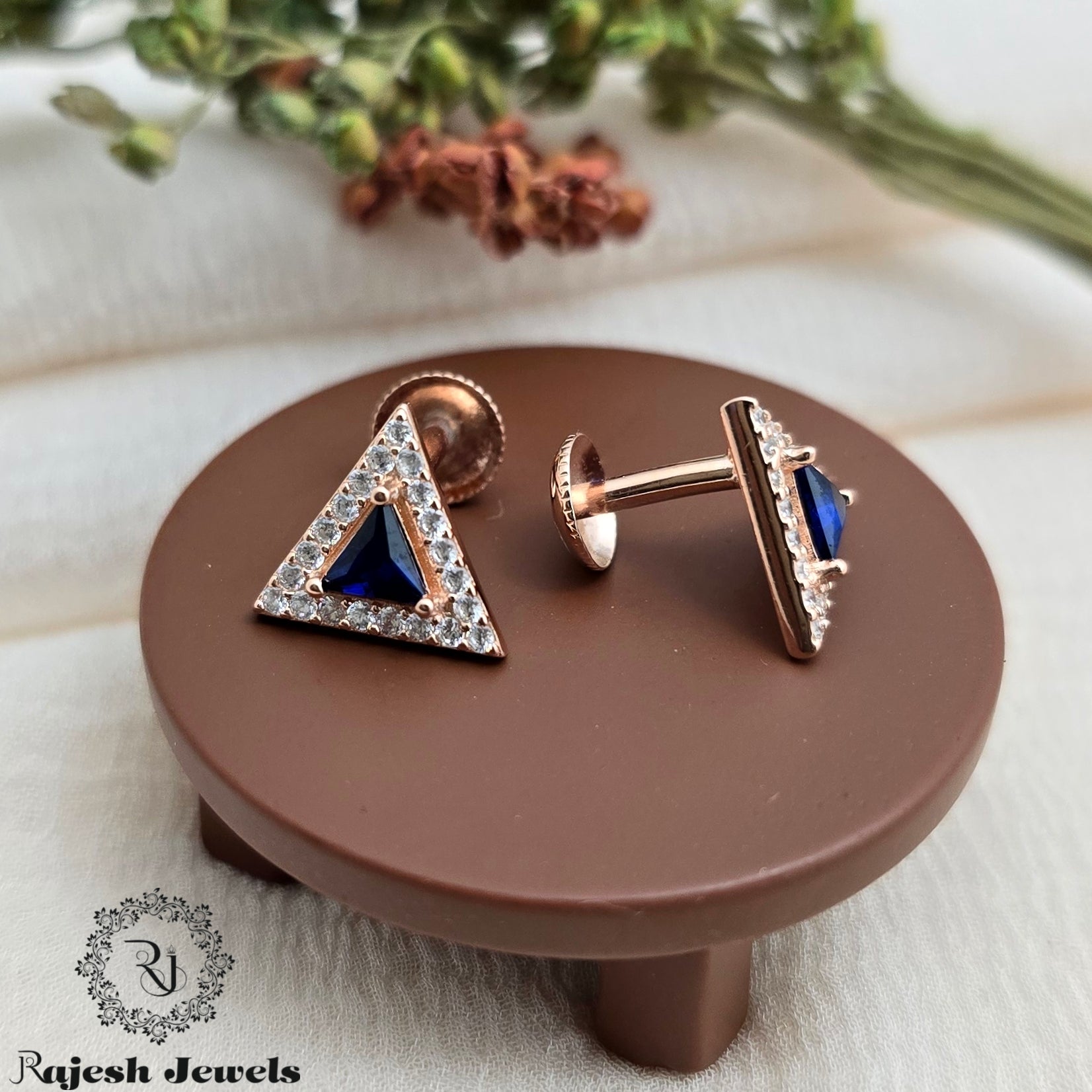 Mesmerizing Blue Rosegold Cz South Screw Stud Earrings