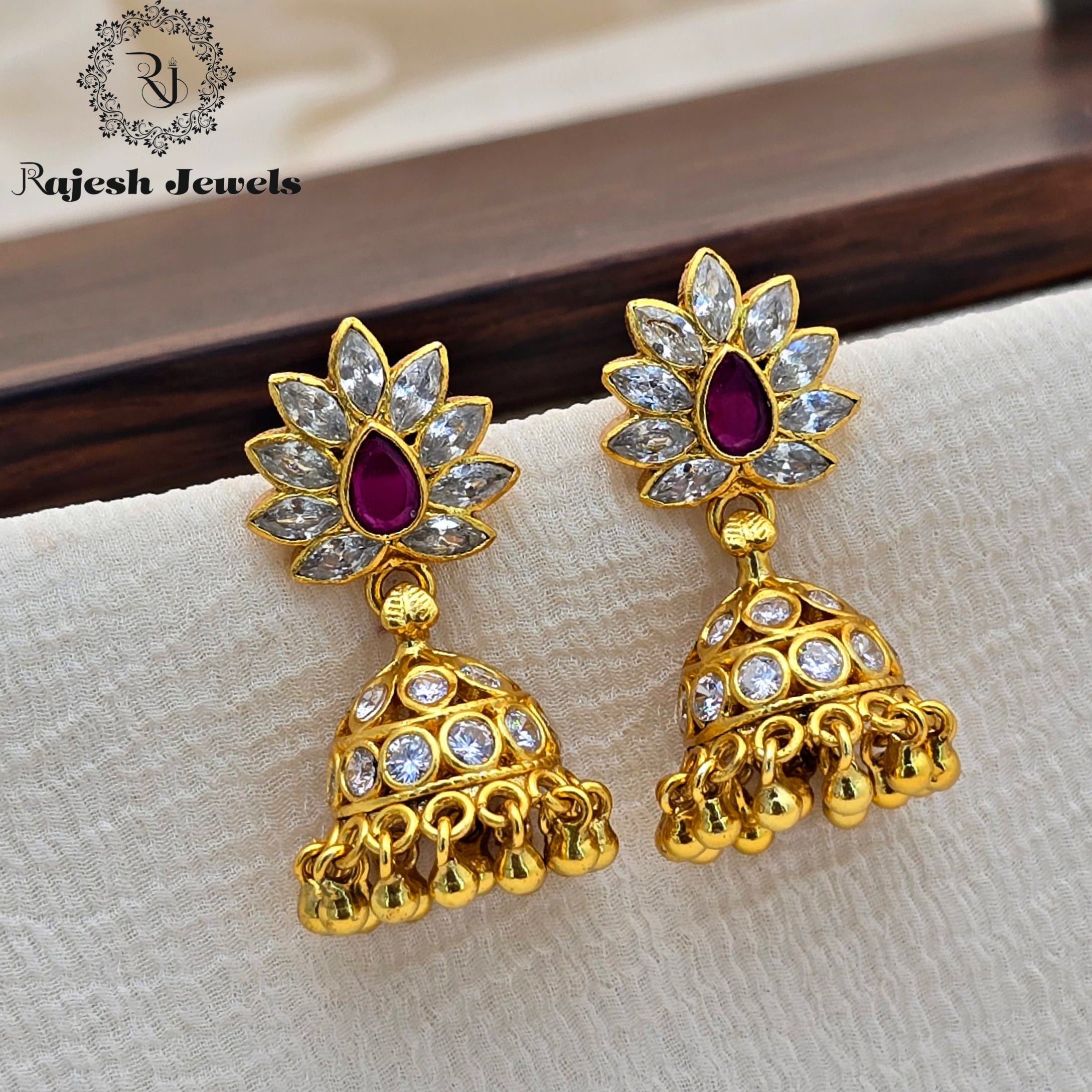 Shimmering Gold Plated Jumka Earrings