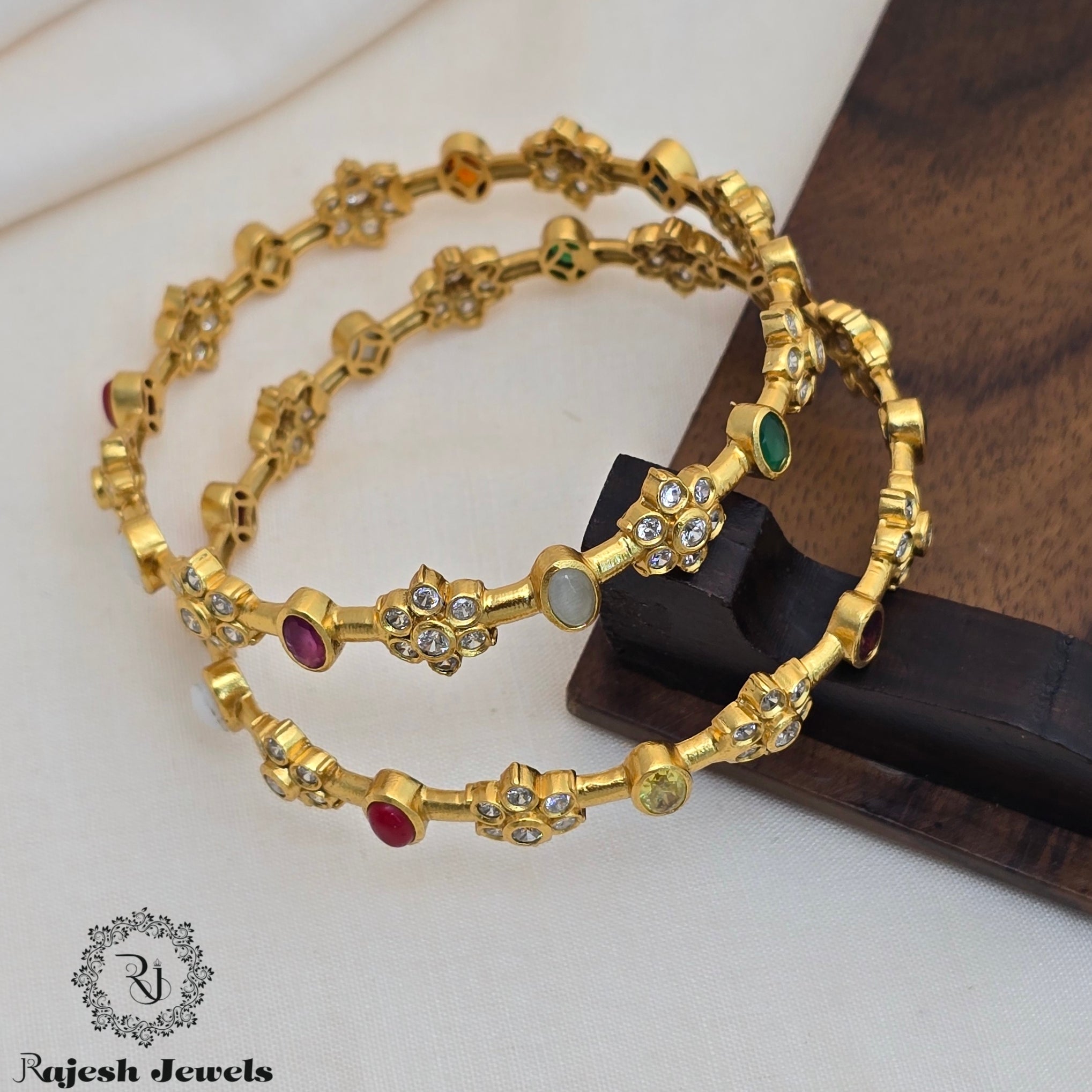 Mesmerizing Cz Navaratna Gold Finish Bangle