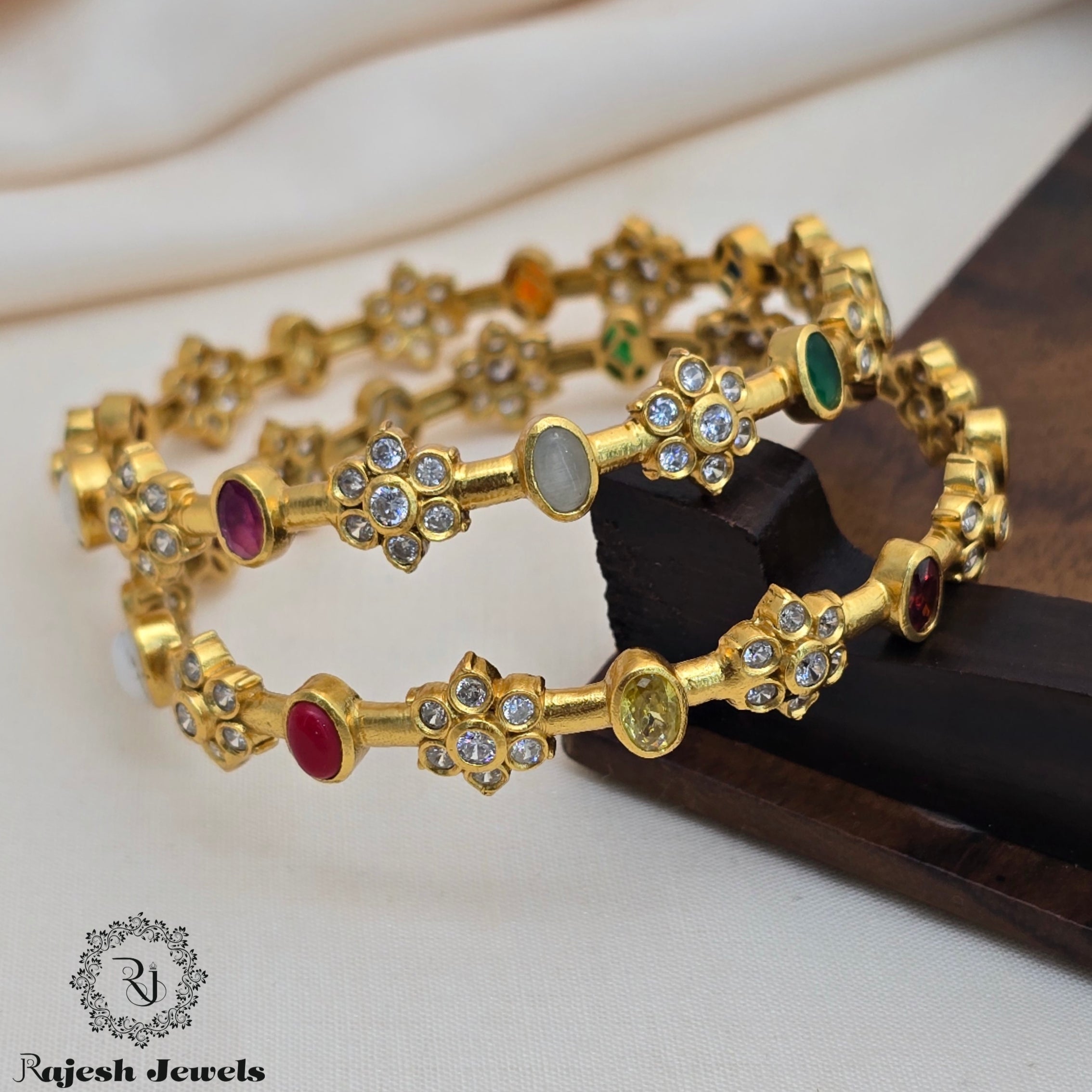 Mesmerizing Cz Navaratna Gold Finish Bangle